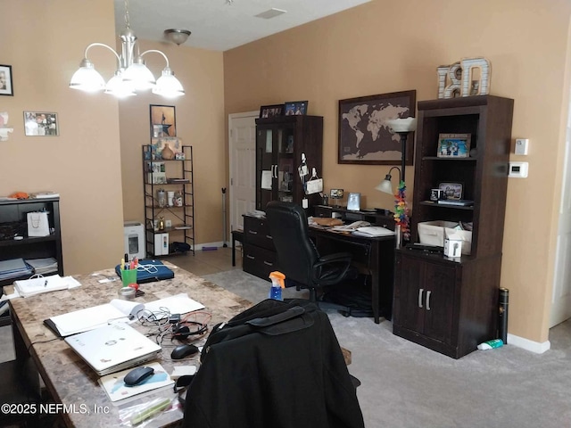 carpeted office space with a chandelier