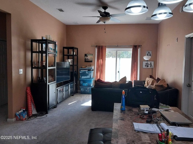 carpeted living room featuring ceiling fan