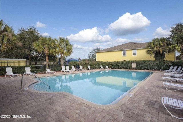 view of swimming pool featuring a patio area