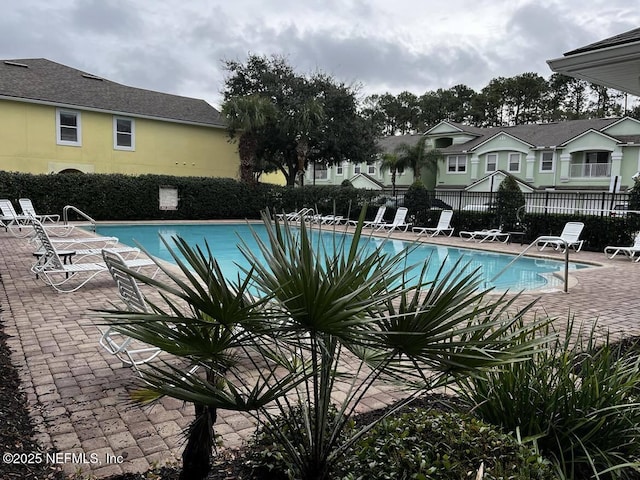 view of swimming pool with a patio area