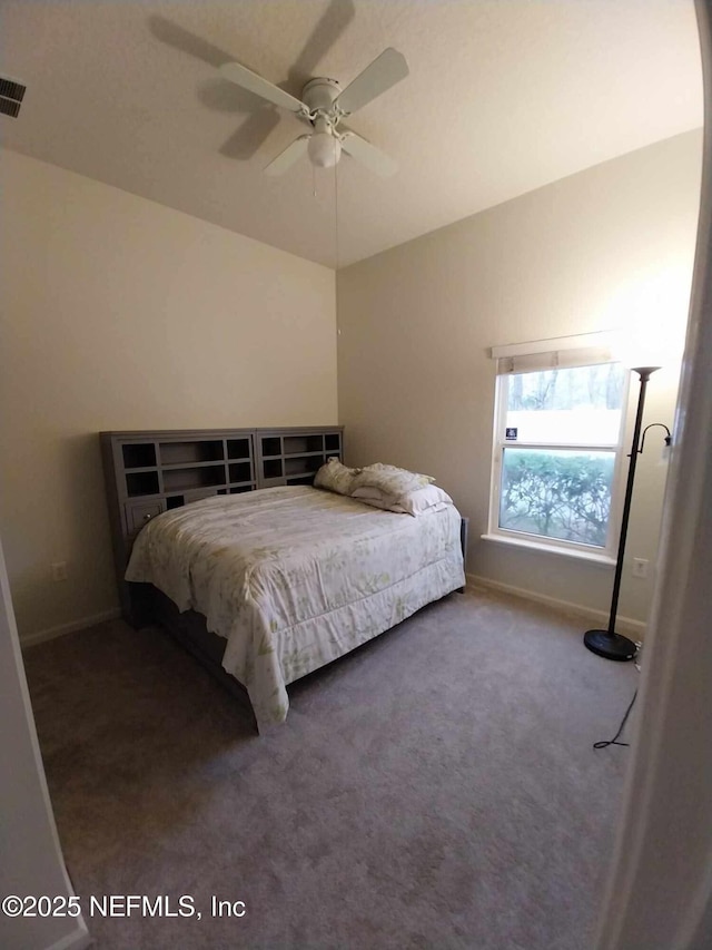 carpeted bedroom with lofted ceiling and ceiling fan