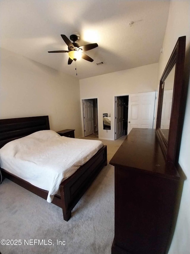 bedroom with light carpet and ceiling fan