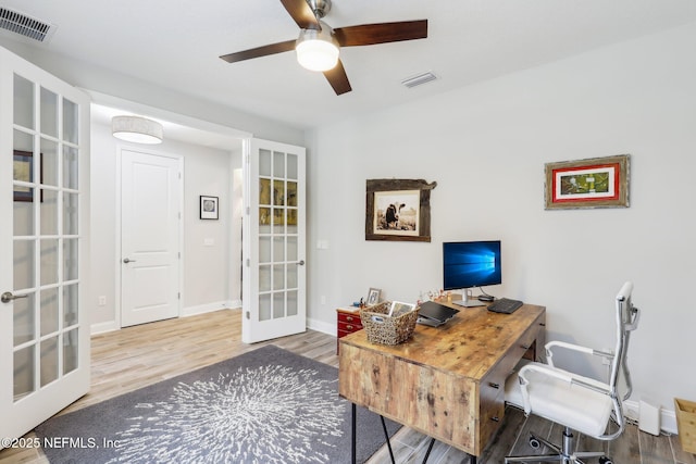 office featuring hardwood / wood-style floors, french doors, and ceiling fan