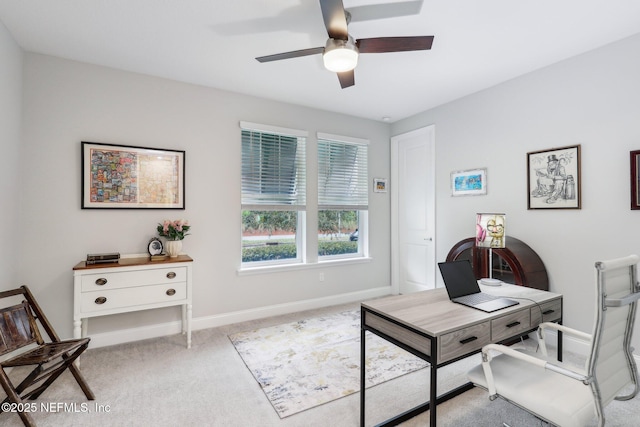 home office featuring light carpet and ceiling fan