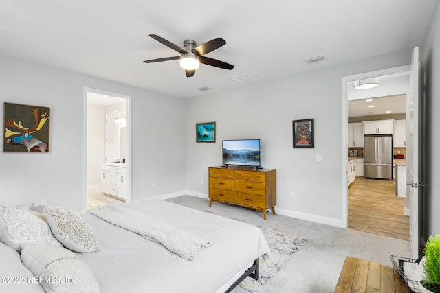 carpeted bedroom featuring stainless steel fridge, ceiling fan, and ensuite bathroom