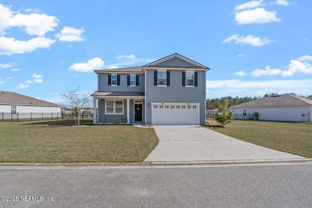 front of property featuring a front yard and a garage