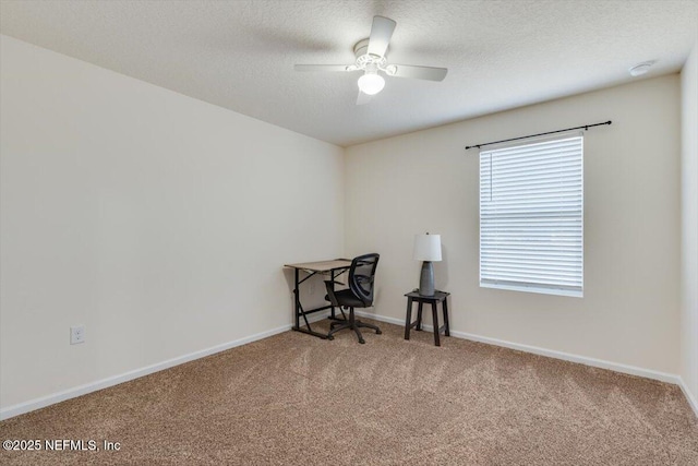 home office featuring carpet and ceiling fan