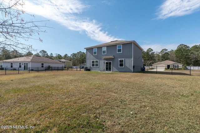 back of house featuring a lawn