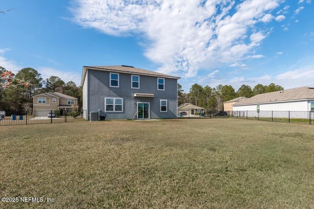 rear view of house featuring cooling unit and a lawn