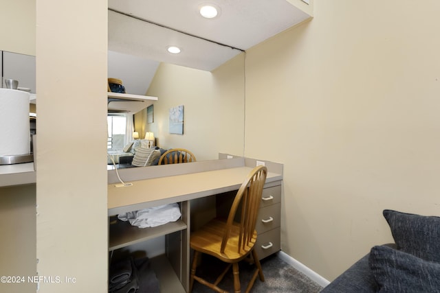 home office featuring carpet and lofted ceiling