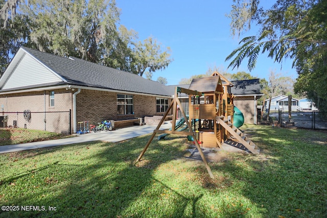 view of play area with a lawn