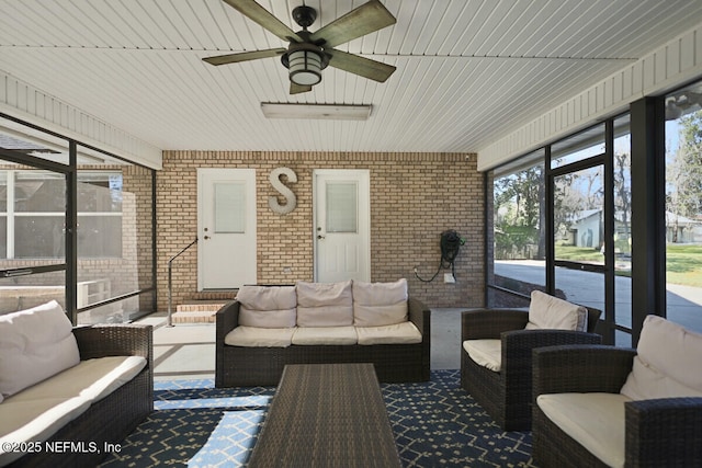 sunroom / solarium with ceiling fan