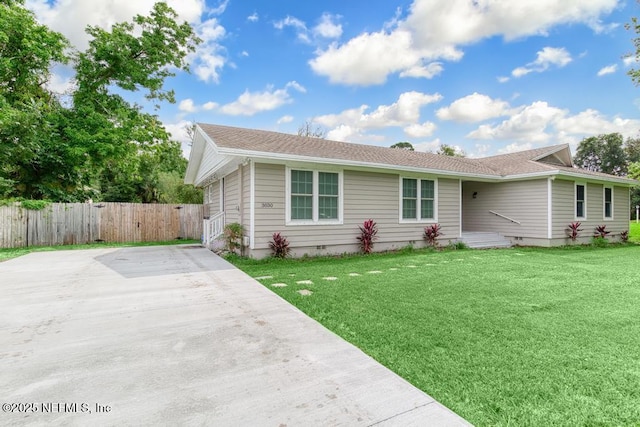 ranch-style home with a front yard