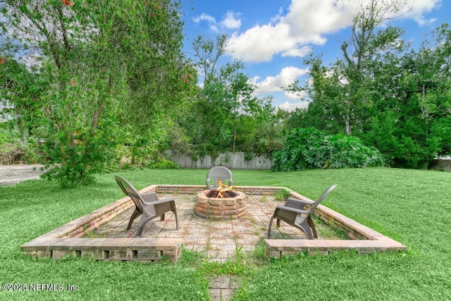 view of patio with a fire pit