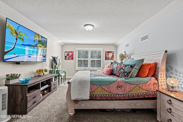 carpeted bedroom with a textured ceiling and lofted ceiling