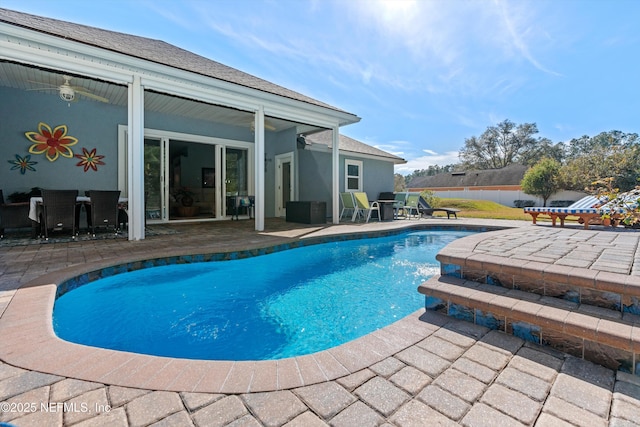 view of swimming pool with a patio area