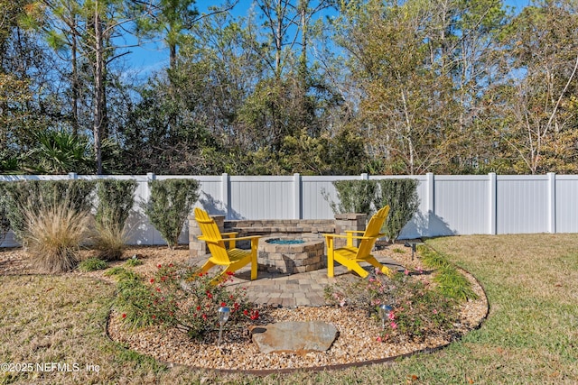 view of yard featuring a fire pit and a patio area