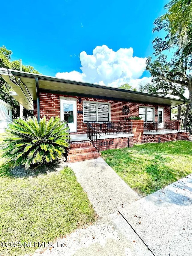 view of front of home with a front yard