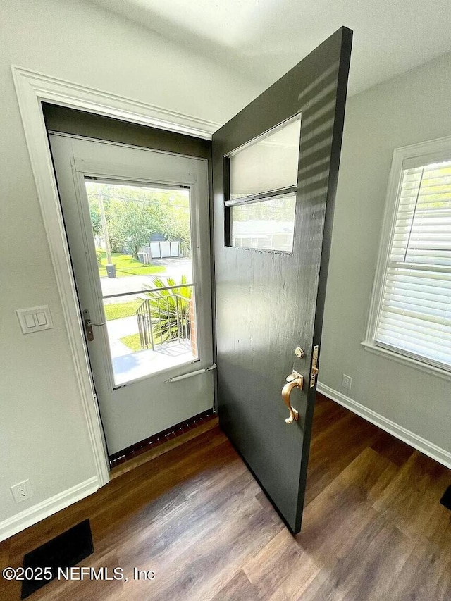 doorway to outside featuring dark hardwood / wood-style floors