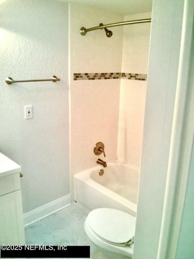 full bathroom with toilet, vanity, tile patterned floors, and tiled shower / bath