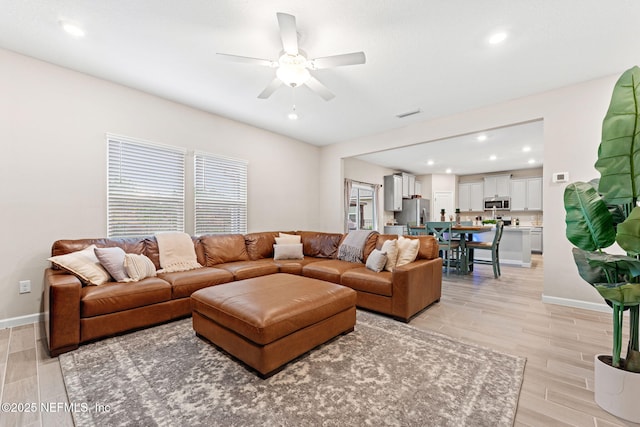 living room featuring ceiling fan