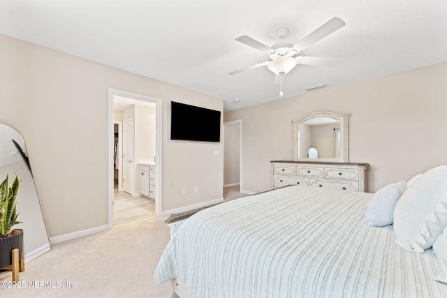 carpeted bedroom with ceiling fan and connected bathroom