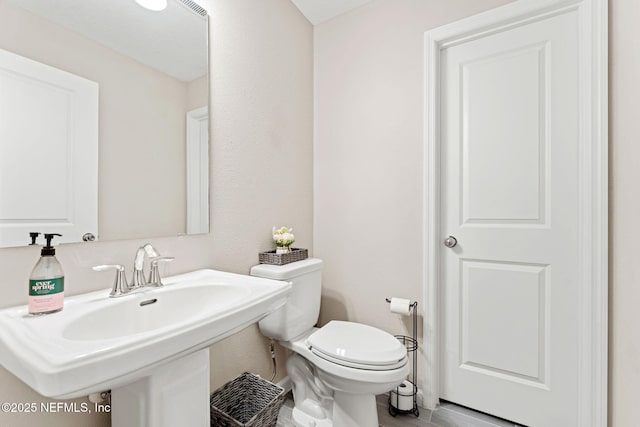 bathroom with sink and toilet