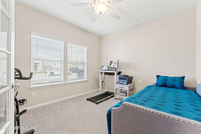 bedroom with ceiling fan and carpet flooring