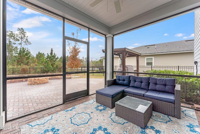 sunroom / solarium with ceiling fan and a wealth of natural light