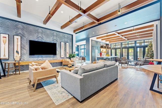 living room with coffered ceiling, light wood-type flooring, and beam ceiling