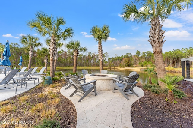 view of patio featuring a fire pit and a water view