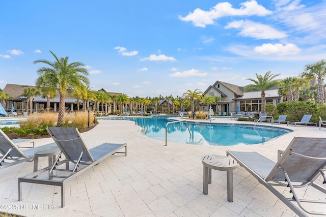 view of swimming pool with a patio