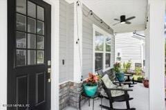 exterior space featuring ceiling fan and a porch