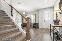 entrance foyer featuring hardwood / wood-style floors