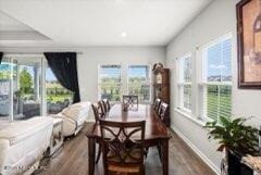 dining room with dark wood-type flooring