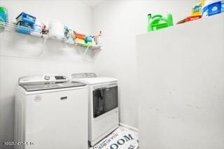 clothes washing area with independent washer and dryer