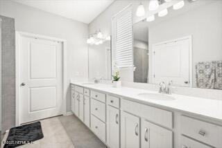 bathroom featuring tile patterned floors and vanity