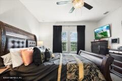 bedroom featuring ceiling fan