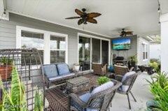 view of patio featuring an outdoor living space and ceiling fan