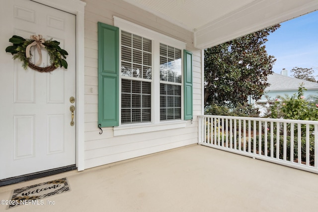 doorway to property with covered porch