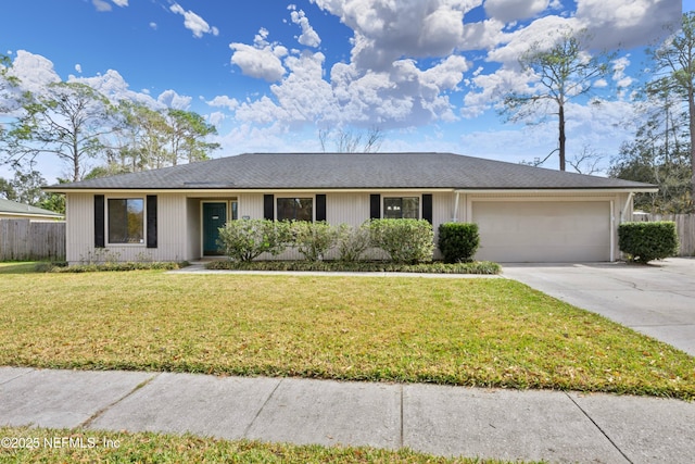 ranch-style home with a garage and a front lawn