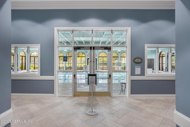 doorway featuring french doors and light tile patterned floors