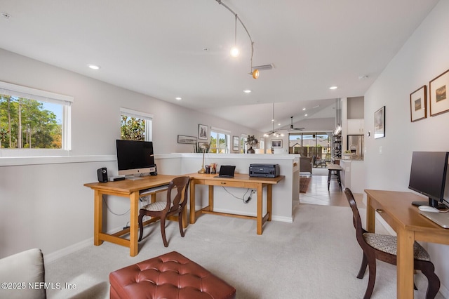 office space with light colored carpet, ceiling fan, and lofted ceiling