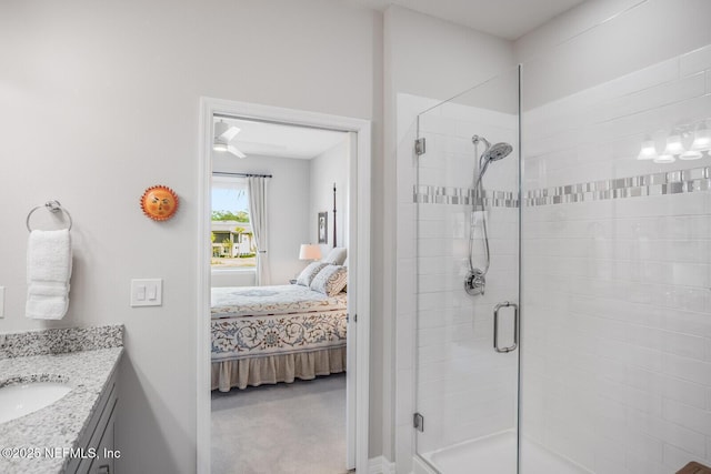 bathroom featuring vanity and an enclosed shower