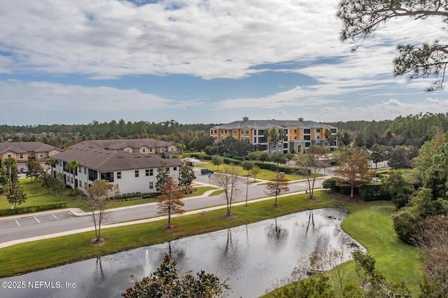 birds eye view of property featuring a water view