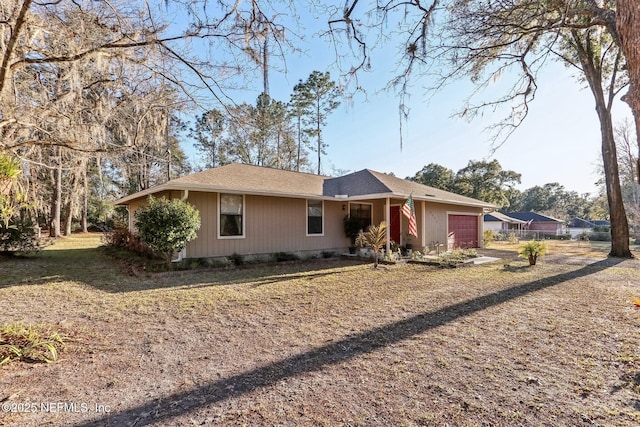 single story home featuring a garage