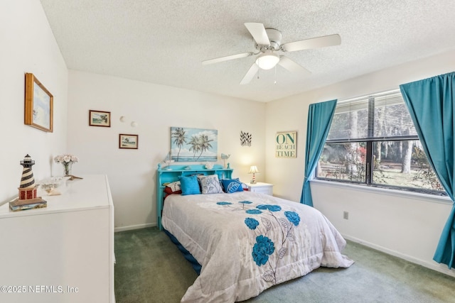 carpeted bedroom with a textured ceiling and ceiling fan