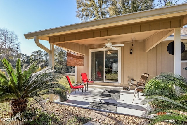 exterior space with ceiling fan and a patio area