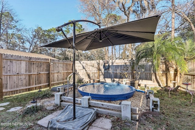 view of patio / terrace featuring a pool