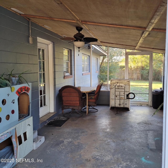 exterior space with ceiling fan